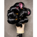 Jet black Half wig with voluminous pinned curls, displayed on a mannequin head stand against a textured gray back wall.